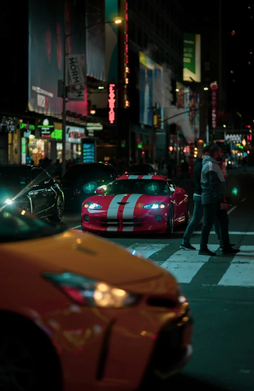 some cars are parked and people crossing the street