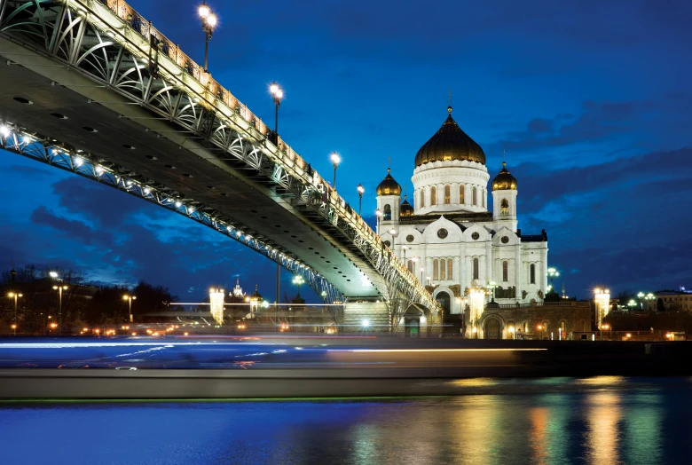 the cathedral of a large church is lit up at night