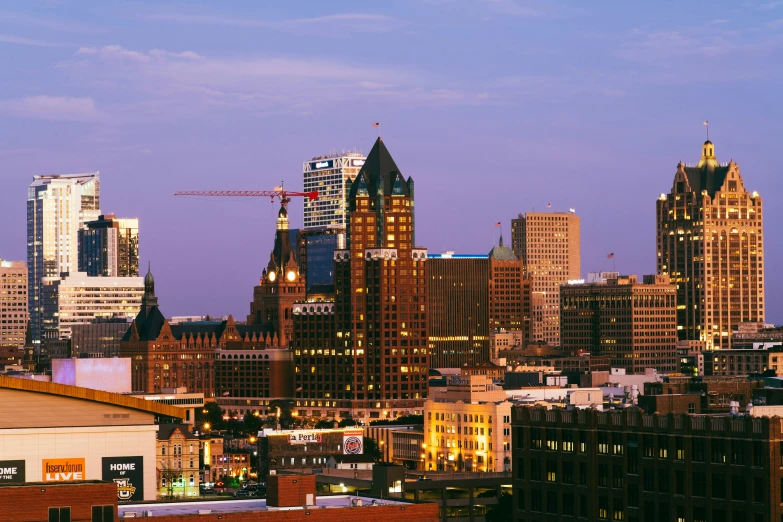 tall buildings and a crane over a city