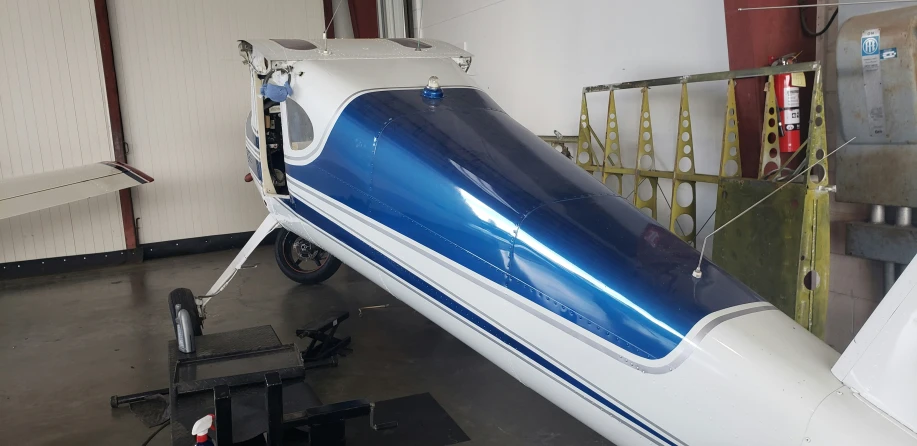 a plane that is being constructed with blue paint