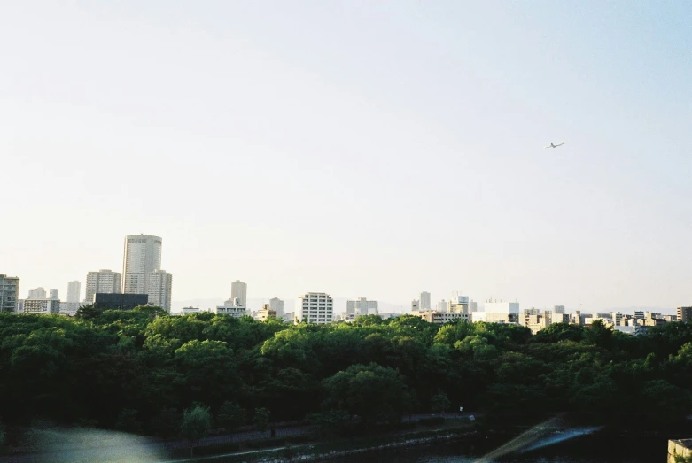 the large buildings have a helicopter flying above them