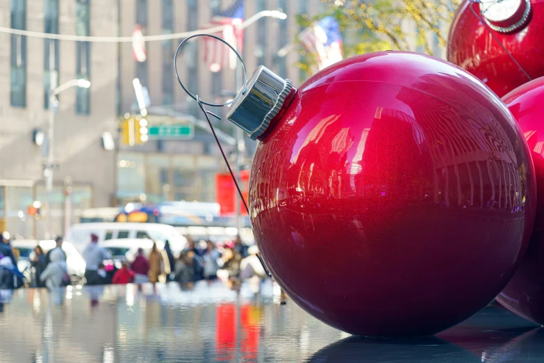 red balls are standing in the middle of a parade