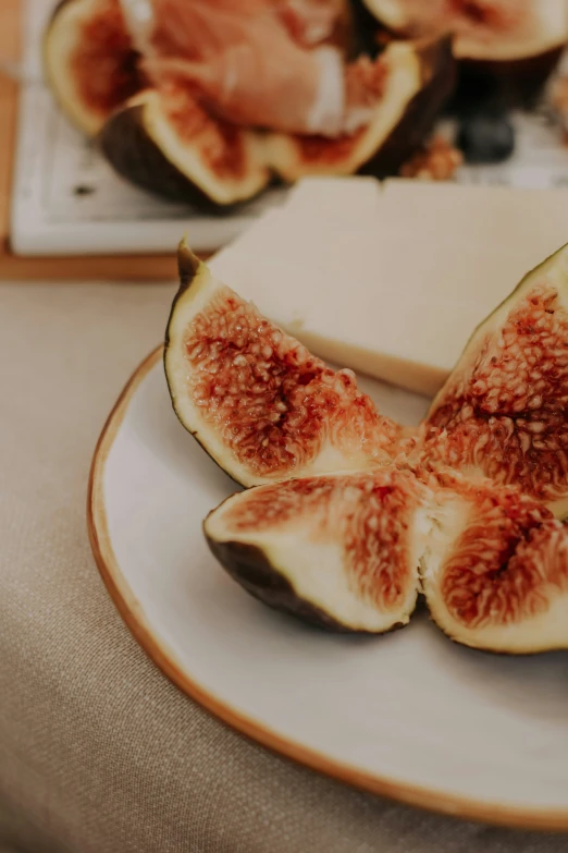 two slices of figs are cut into pieces on a plate