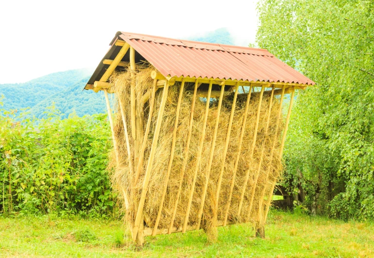 a large stack of hay tied to a metal roof