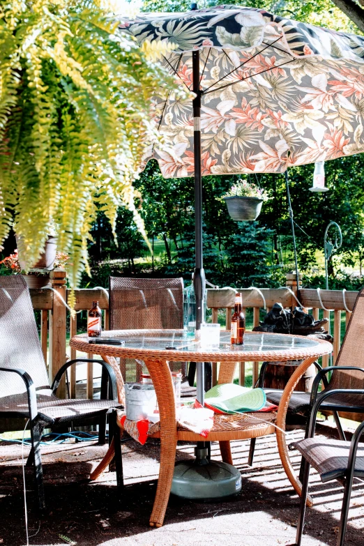 a patio table with a parasol on top