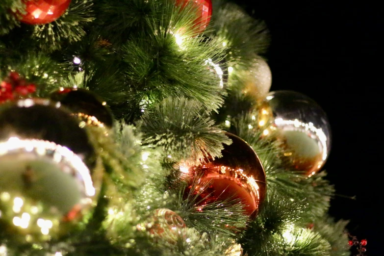 an image of an unlit christmas tree in full ornament