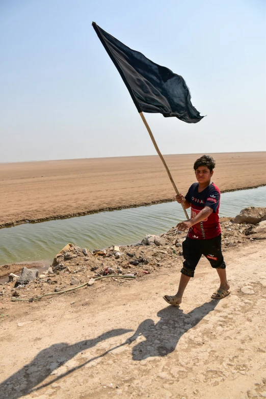 a  carries a flag in his hands