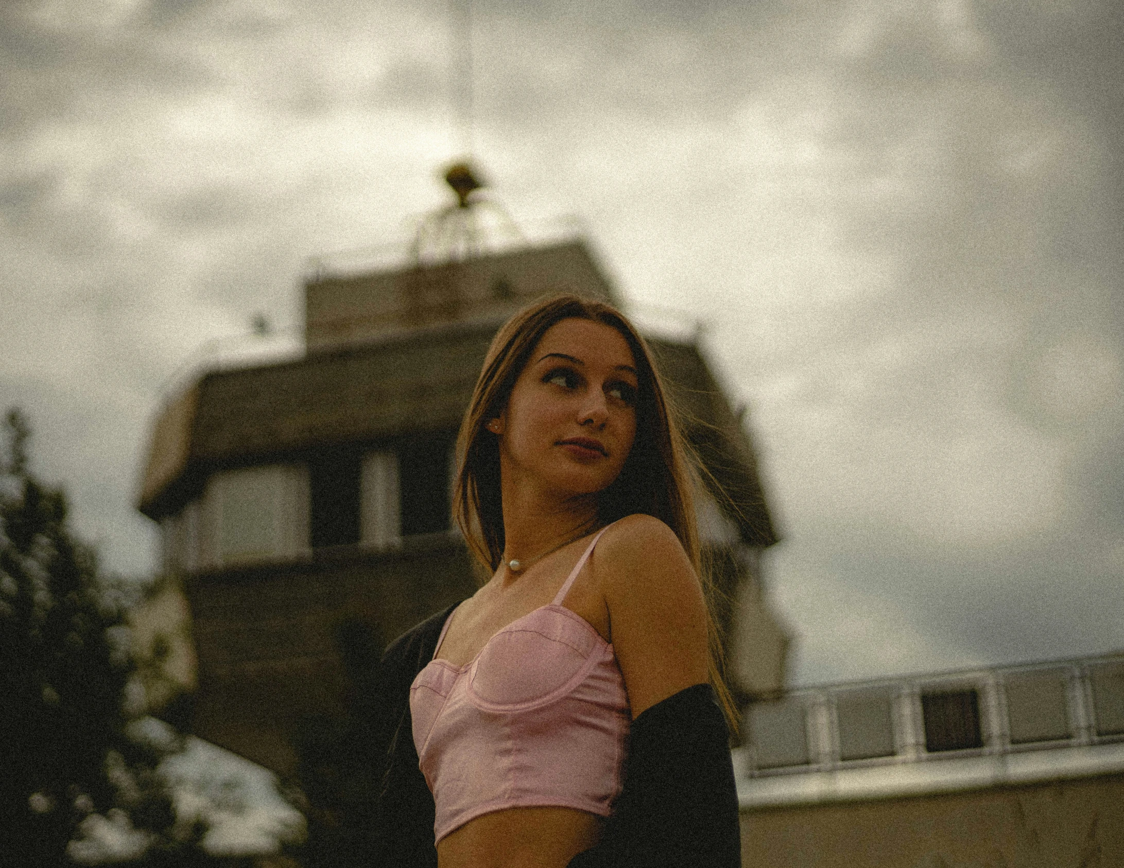 a woman with very short hair and a small top