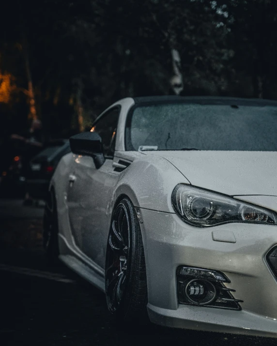 white car parked in front of other cars