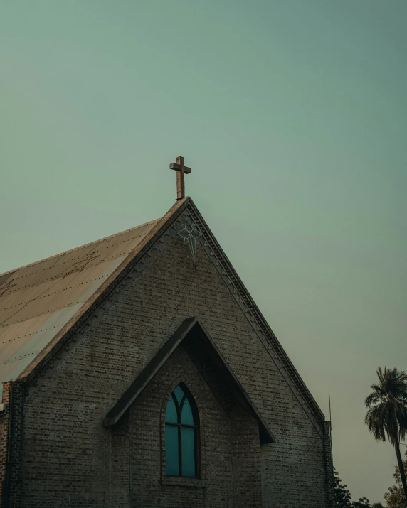 an old church with a cross on it