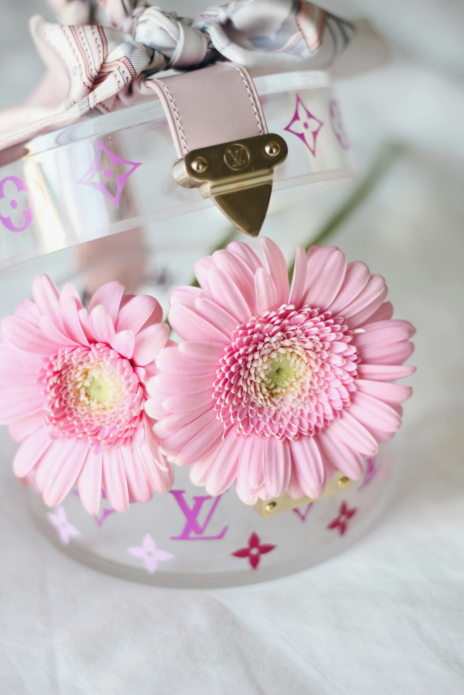 a pair of flowers placed in an air conditioner