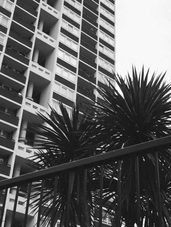 a tall building with balconies on it