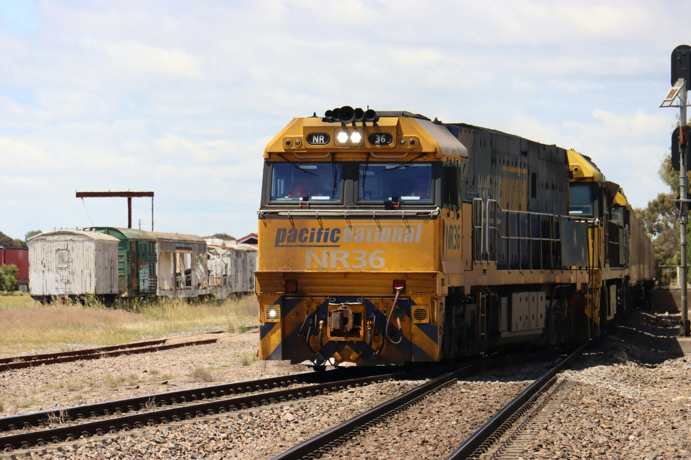 an old freight train in an empty industrial area