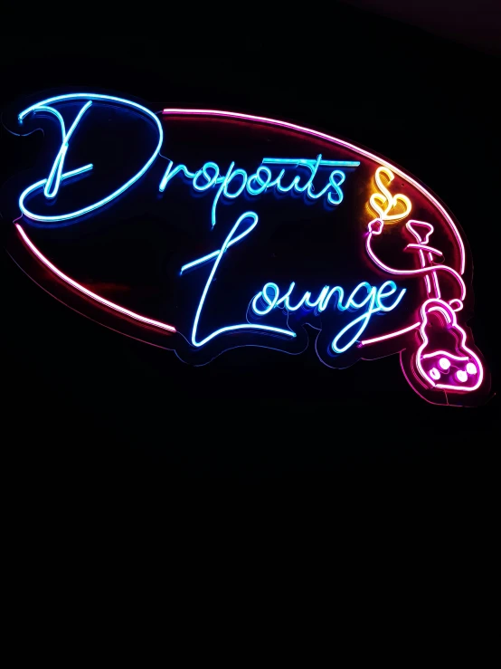 a neon sign hanging in the side of a building