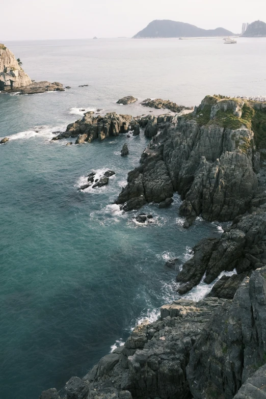 rocky coast covered in clear blue water and waves