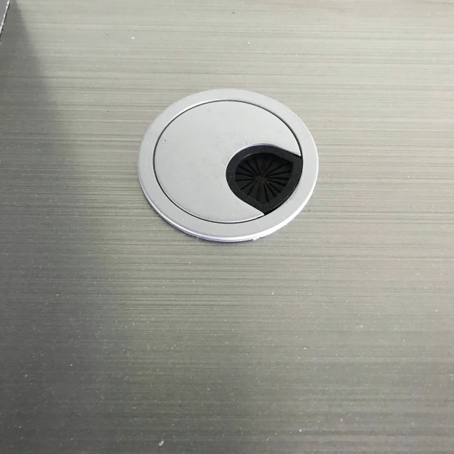 the drain in the metal surface is white and chrome