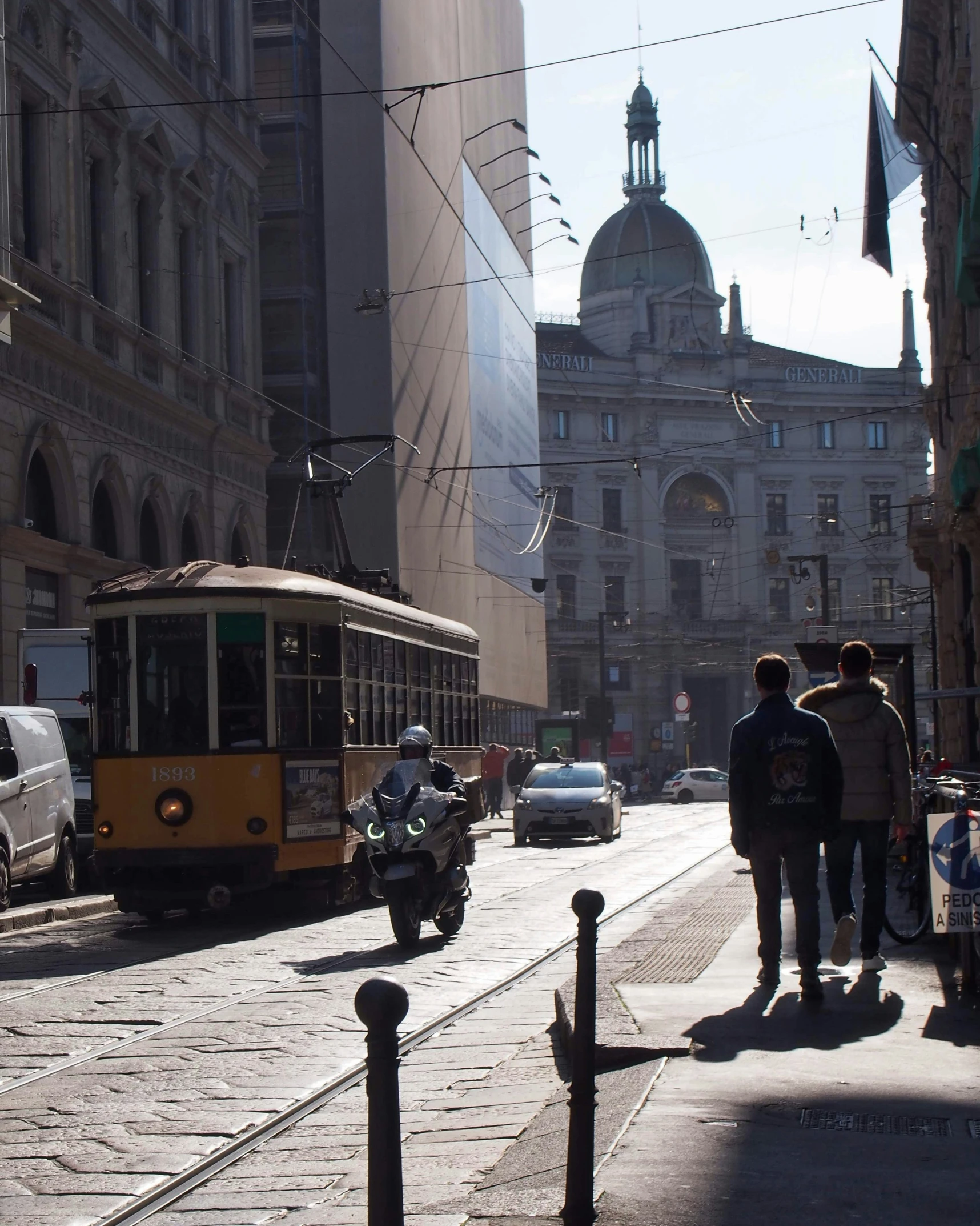 a city street filled with lots of traffic and tall buildings