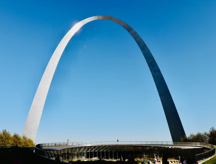 a huge white tall obelisk towering over a city