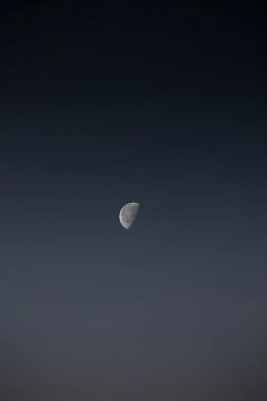 a lone airplane is shown flying across the sky at night