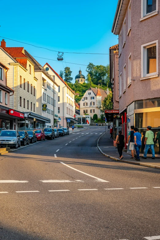 many cars are parked on the side of the road