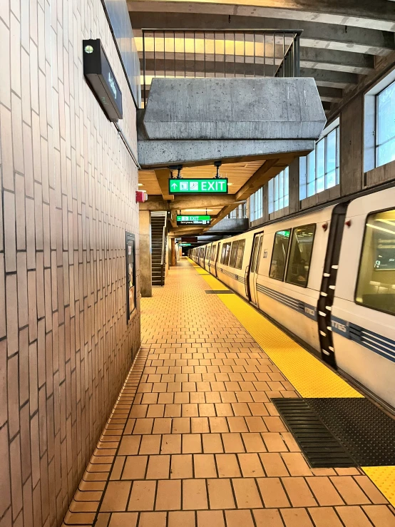 two trains in a station with two windows