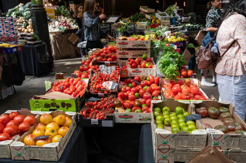 a group of crates that have various fruits and vegetables in them