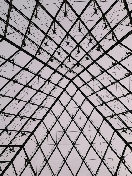 a steel structure that has a blue sky and clouds