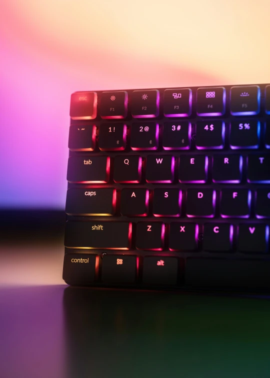 a keyboard sitting on a table with a blurred background