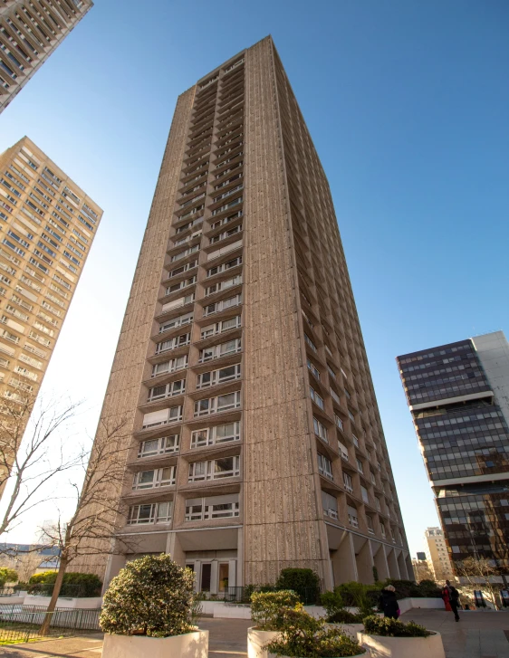 an upward view of two very tall buildings