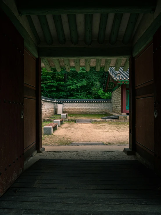 open doors leading to an outdoor patio with mountains in the background