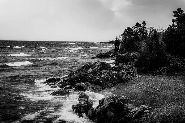 dark storm coming in on the shoreline of the ocean