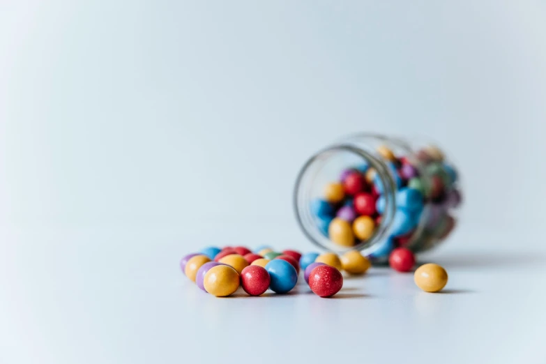 two jars with candy inside filled with them