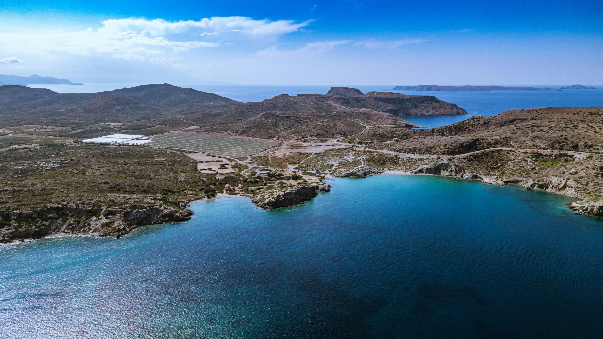 the view from the air of an island and ocean