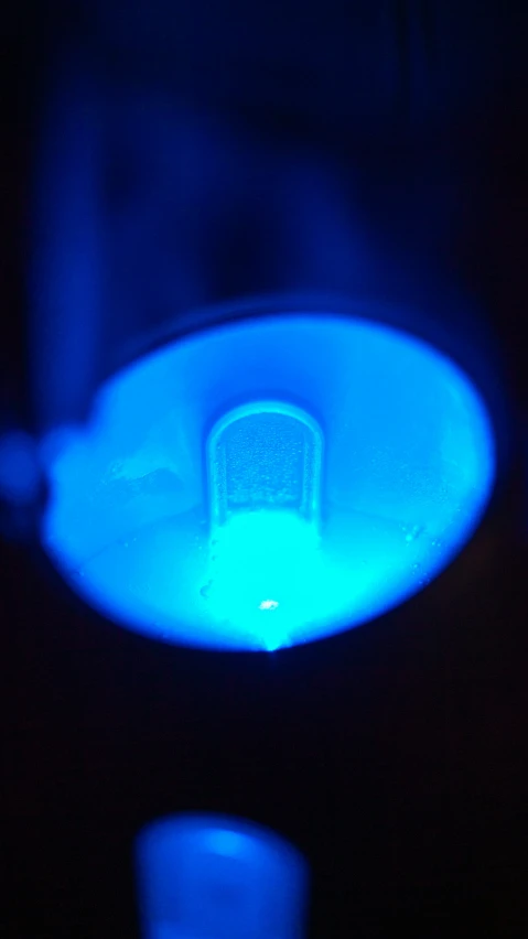 a blue light is on with some kind of bowl