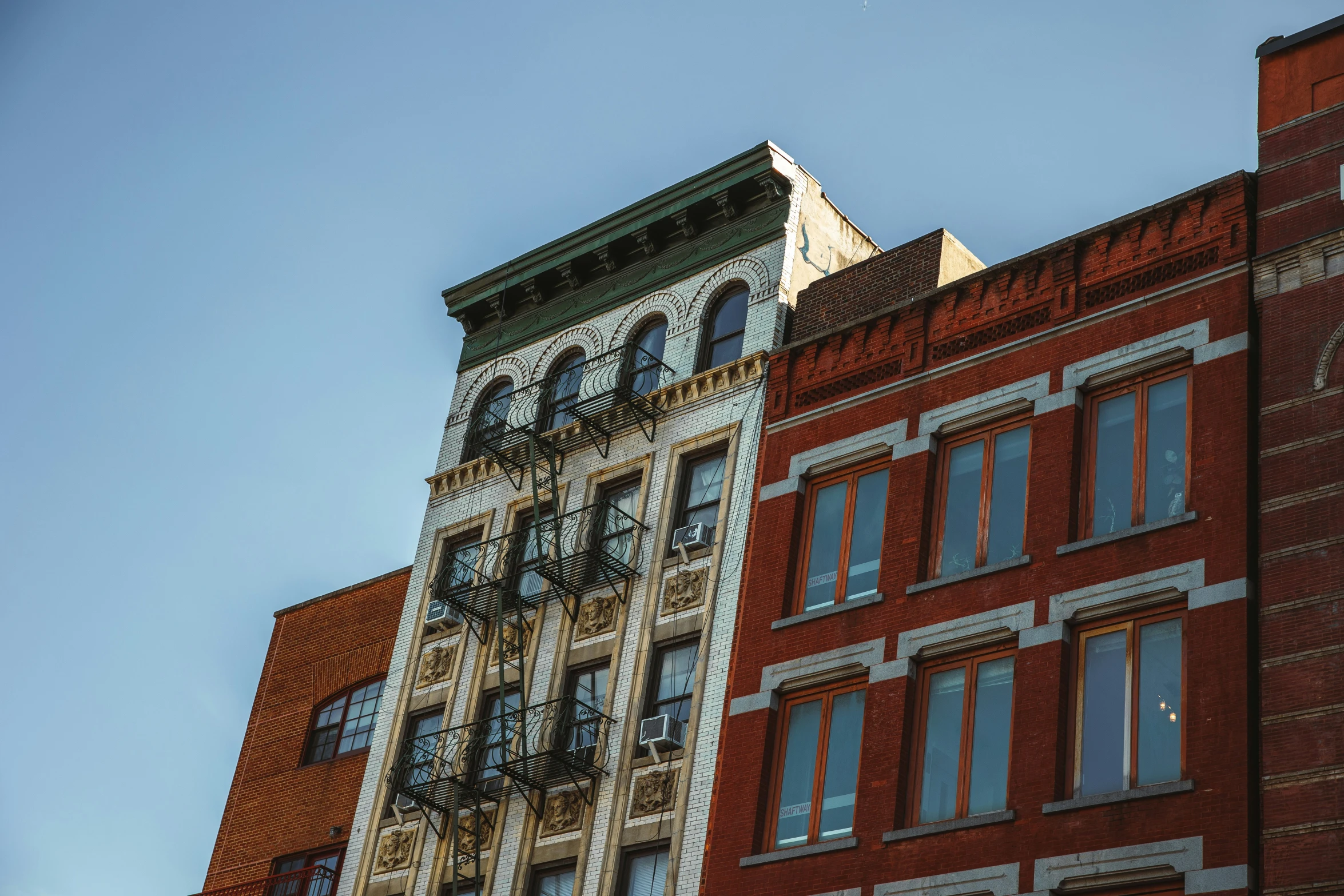 an image of two buildings that appear to be looking up