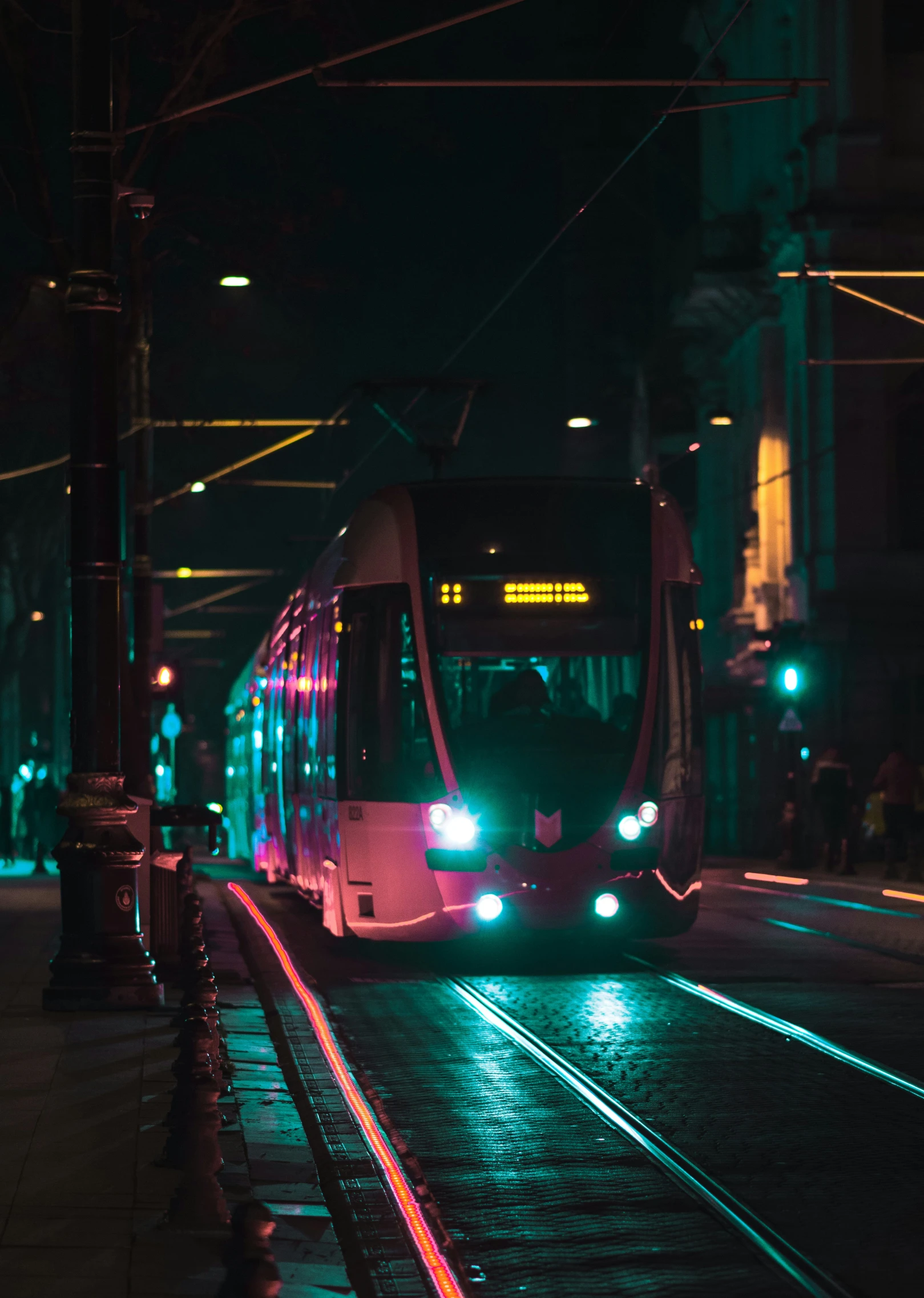 a train moving through an alley at night