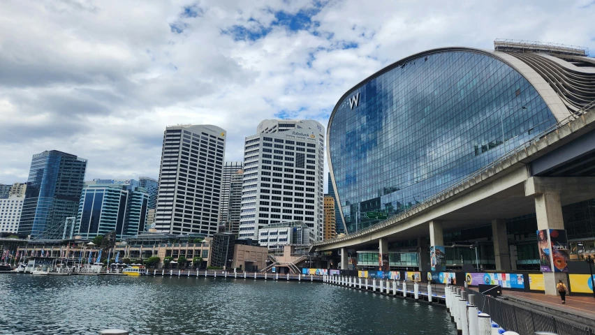 city buildings by the water along the walkway