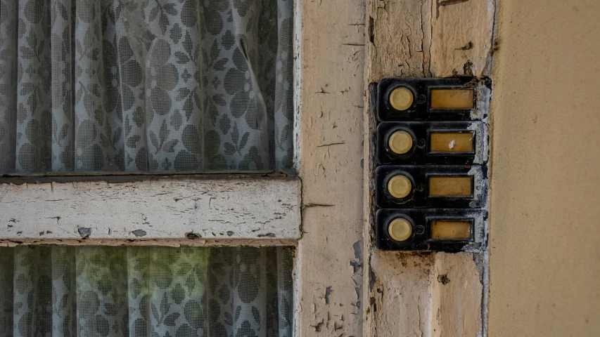 old looking electrical box attached to a building