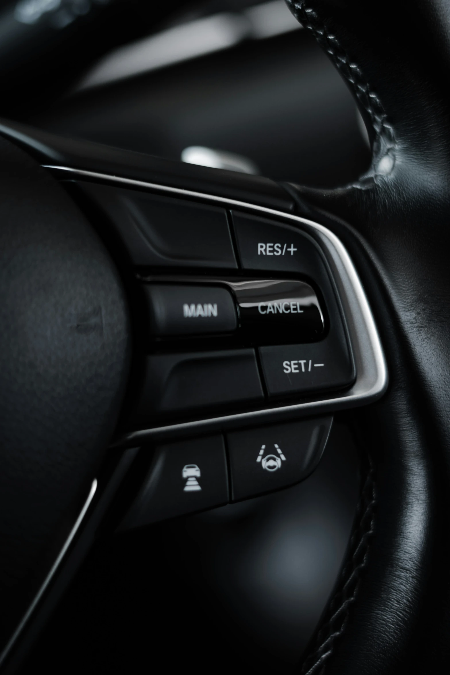 the controls in a vehicle with black leather