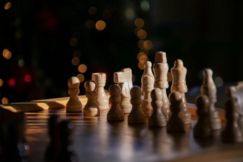 a close up of a chess board with pieces missing