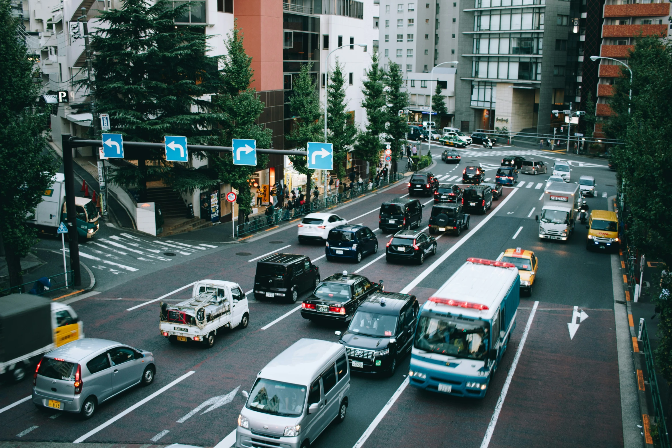 a very busy city street with many cars