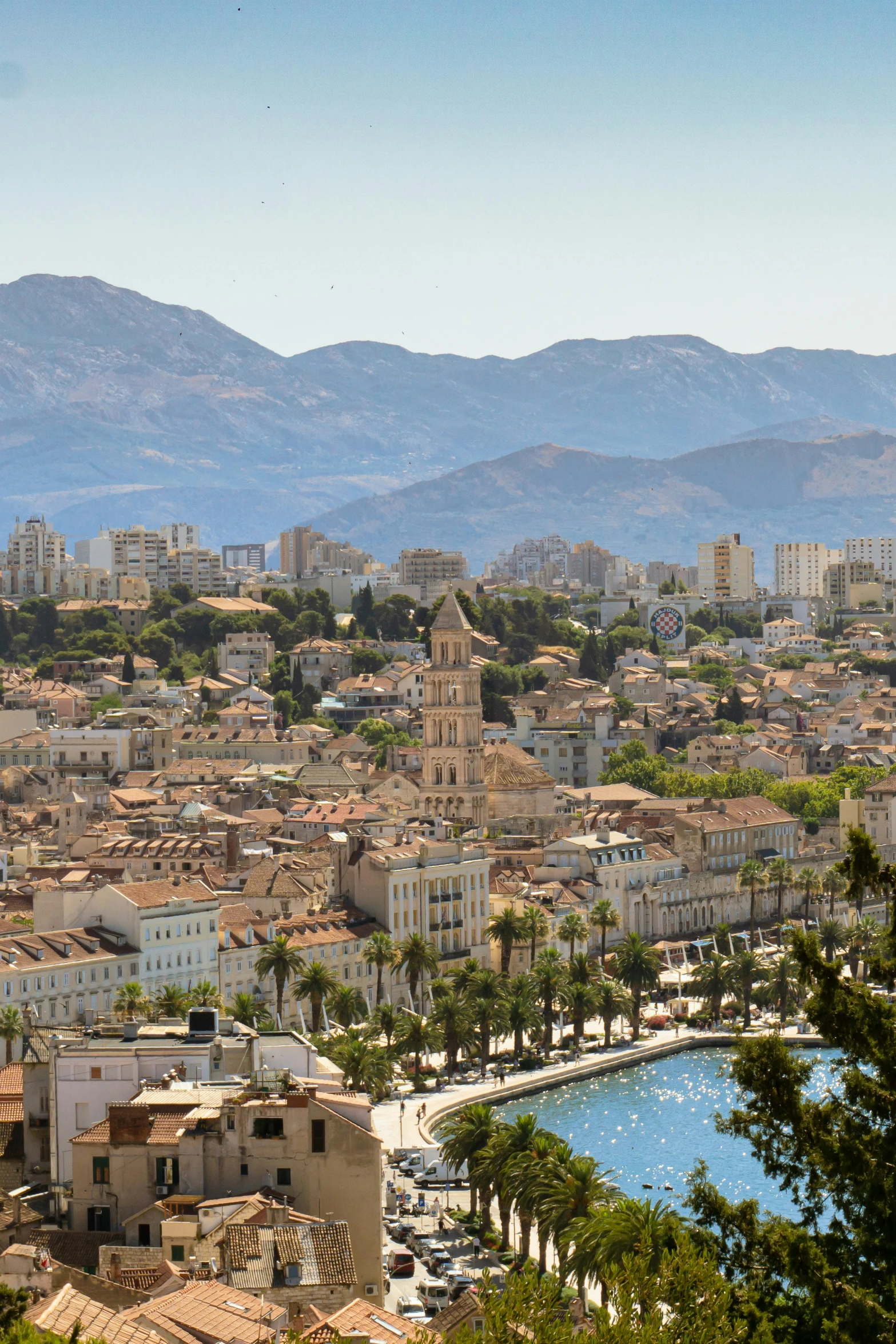 view from above of city and mountain in the background