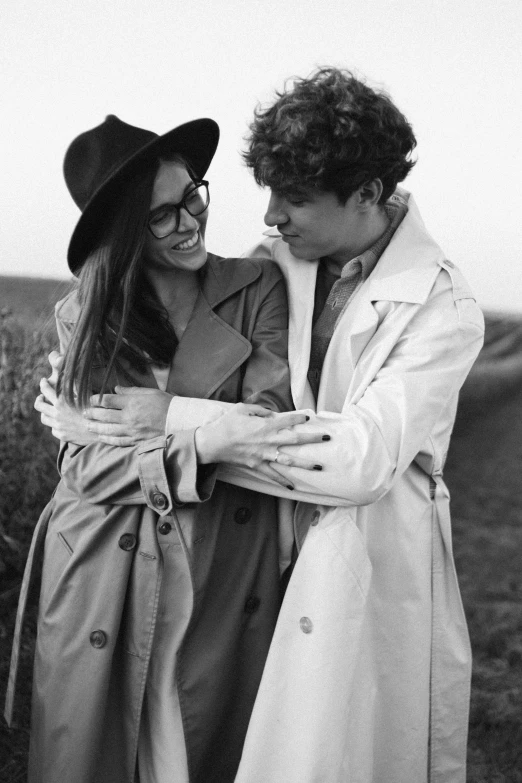 a young man and woman in black and white emcing