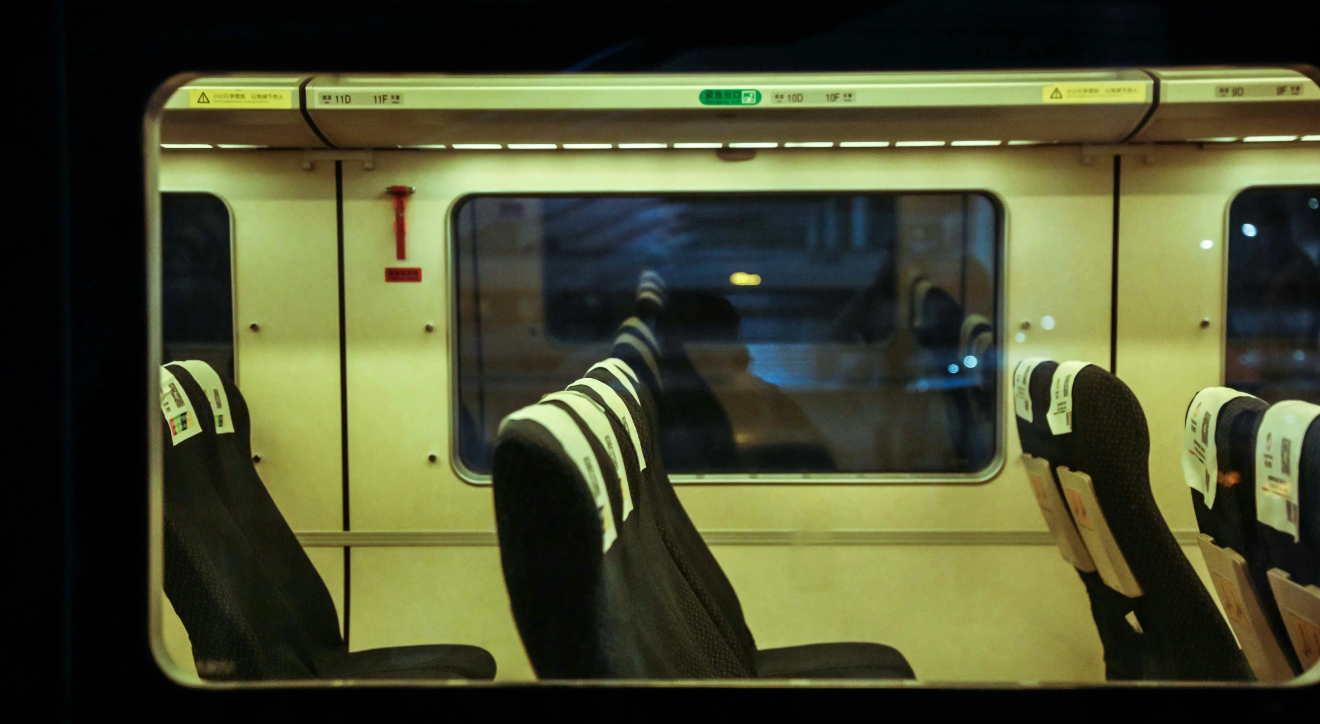 the chairs are empty of people riding on this commuter train