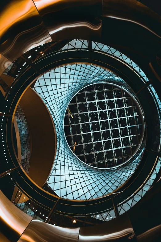 looking up into a spiral staircase from inside