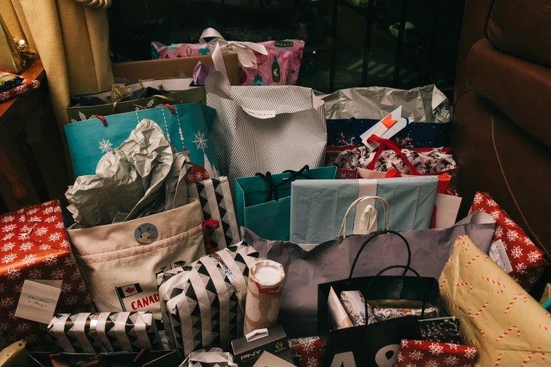 there is a pile of shopping bags piled on top of each other