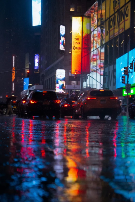 a street with cars in it at night