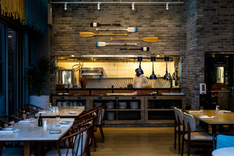 a dining area with many chairs around the table