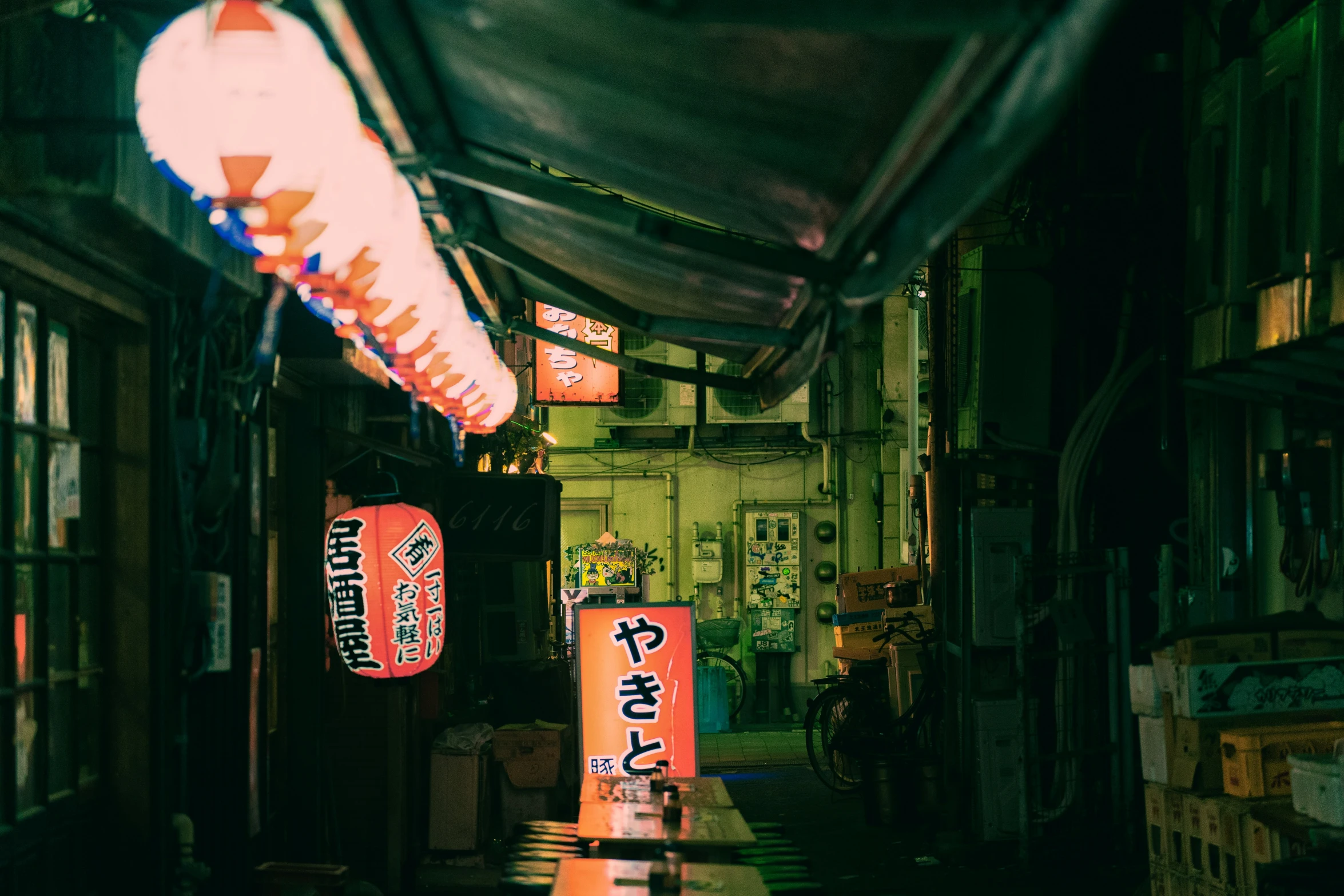 the side of a restaurant covered in neon lights