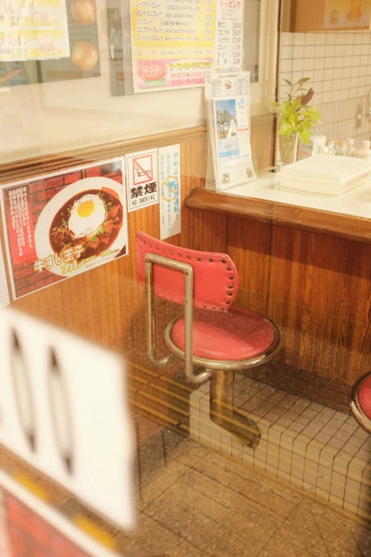 a restaurant that has red chairs and menus